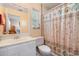 Bathroom with shower/tub combo and patterned curtain at 2700 Magdalina Dr # 2B, Punta Gorda, FL 33950