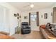 Relaxing bedroom with recliner, sofa bed, and ample natural light at 2700 Magdalina Dr # 2B, Punta Gorda, FL 33950