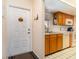 Front entry with white door and view into kitchen at 2700 Magdalina Dr # 2B, Punta Gorda, FL 33950