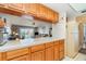 Kitchen with ample counter space and wood cabinets at 2700 Magdalina Dr # 2B, Punta Gorda, FL 33950