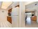 Kitchen with white appliances and wood cabinets at 2700 Magdalina Dr # 2B, Punta Gorda, FL 33950