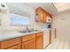Kitchen with sink, dishwasher, and white appliances at 2700 Magdalina Dr # 2B, Punta Gorda, FL 33950