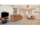 Living room with leather sofa and open floor plan at 2700 Magdalina Dr # 2B, Punta Gorda, FL 33950