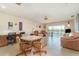 Living room with recliner chairs and access to balcony at 2700 Magdalina Dr # 2B, Punta Gorda, FL 33950