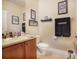 Clean bathroom with wood cabinets and a toilet at 3011 Marble Crest Dr, Land O Lakes, FL 34638