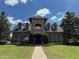 Exterior of community clubhouse with stone facade and landscaping at 3011 Marble Crest Dr, Land O Lakes, FL 34638