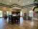 Community room with tables, chairs, and a small kitchen at 3011 Marble Crest Dr, Land O Lakes, FL 34638
