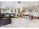 Spacious game room with leather sectional sofa and large TV at 3011 Marble Crest Dr, Land O Lakes, FL 34638