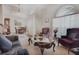 Living room with comfy seating and a large window at 3011 Marble Crest Dr, Land O Lakes, FL 34638