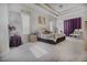 Large bedroom with plush carpet and ensuite bath at 3011 Marble Crest Dr, Land O Lakes, FL 34638