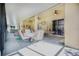 Covered patio with dining area and access to the lanai at 3011 Marble Crest Dr, Land O Lakes, FL 34638