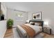 Spacious bedroom with wood flooring and neutral decor at 304 S Habana Ave # A3, Tampa, FL 33609