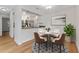 Bright dining area with a table for four and open kitchen access at 304 S Habana Ave # A3, Tampa, FL 33609