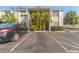 Exterior view of condo building with parking and landscaping at 304 S Habana Ave # A3, Tampa, FL 33609