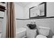 Bathroom with black sink, white tub and patterned tile at 319 26Th W St, Bradenton, FL 34205