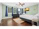Bedroom with a bed, dresser, and hardwood floors at 319 26Th W St, Bradenton, FL 34205