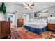 Spacious main bedroom with wooden dresser and large area rug at 319 26Th W St, Bradenton, FL 34205