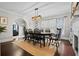 Formal dining room with wooden table, six chairs, and a jute rug at 319 26Th W St, Bradenton, FL 34205
