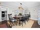 Formal dining room with wooden table, six chairs, and a jute rug at 319 26Th W St, Bradenton, FL 34205
