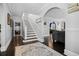 Entryway with staircase and view into living room at 319 26Th W St, Bradenton, FL 34205