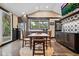 Kitchen with stainless steel appliances and farmhouse table at 319 26Th W St, Bradenton, FL 34205
