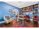 Charming library with built-in shelves, hardwood floors, and comfortable seating at 319 26Th W St, Bradenton, FL 34205