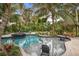 Expansive pool with spa and tropical landscaping at 319 26Th W St, Bradenton, FL 34205