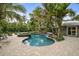 Relaxing pool and spa surrounded by lush landscaping at 319 26Th W St, Bradenton, FL 34205