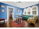 Bright sunroom features hardwood floors, arched windows, and a comfy seating area at 319 26Th W St, Bradenton, FL 34205