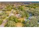 Property view showcasing home, pool, and large lot at 3704 Berger Rd, Lutz, FL 33548