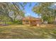 Landscaped backyard with a fountain and lush greenery at 3704 Berger Rd, Lutz, FL 33548