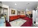 Finished basement with red couches and office area at 3704 Berger Rd, Lutz, FL 33548