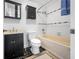 Clean bathroom with dark vanity, bathtub and shower at 3704 Berger Rd, Lutz, FL 33548