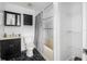 Bathroom with bathtub, toilet, and updated vanity at 3704 Berger Rd, Lutz, FL 33548