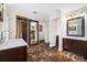 Bright bathroom with double sinks, shower, and marble flooring at 3704 Berger Rd, Lutz, FL 33548