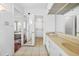 Bathroom with double sinks, a large mirror and a walk-in closet at 3704 Berger Rd, Lutz, FL 33548