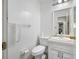 Simple bathroom with white vanity and toilet at 3704 Berger Rd, Lutz, FL 33548