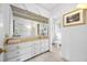 Bright bathroom features double sinks, a toilet and a shower at 3704 Berger Rd, Lutz, FL 33548