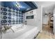 Bathroom with a jacuzzi tub and blue tile at 3704 Berger Rd, Lutz, FL 33548