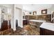 Spa-like bathroom featuring a jetted tub, marble tile, and and sinks at 3704 Berger Rd, Lutz, FL 33548