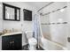 Clean bathroom with a shower/tub combo and updated vanity at 3704 Berger Rd, Lutz, FL 33548