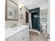 Bathroom with marble vanity and walk-in shower at 3704 Berger Rd, Lutz, FL 33548