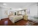 Bright bedroom with wood floors and mirrored furniture at 3704 Berger Rd, Lutz, FL 33548