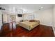 Main bedroom with hardwood floors and access to balcony at 3704 Berger Rd, Lutz, FL 33548