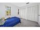 Well-lit bedroom with a comfortable bed and plenty of closet space at 3704 Berger Rd, Lutz, FL 33548