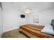 Spacious bedroom with ample closet space and a comfortable bed at 3704 Berger Rd, Lutz, FL 33548