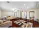 Main bedroom with hardwood floors and access to balcony at 3704 Berger Rd, Lutz, FL 33548