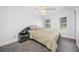 Cozy bedroom with a ceiling fan and large windows at 3704 Berger Rd, Lutz, FL 33548