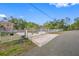 Home's gated entrance with brick driveway at 3704 Berger Rd, Lutz, FL 33548