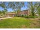 House exterior with lush landscaping and driveway at 3704 Berger Rd, Lutz, FL 33548